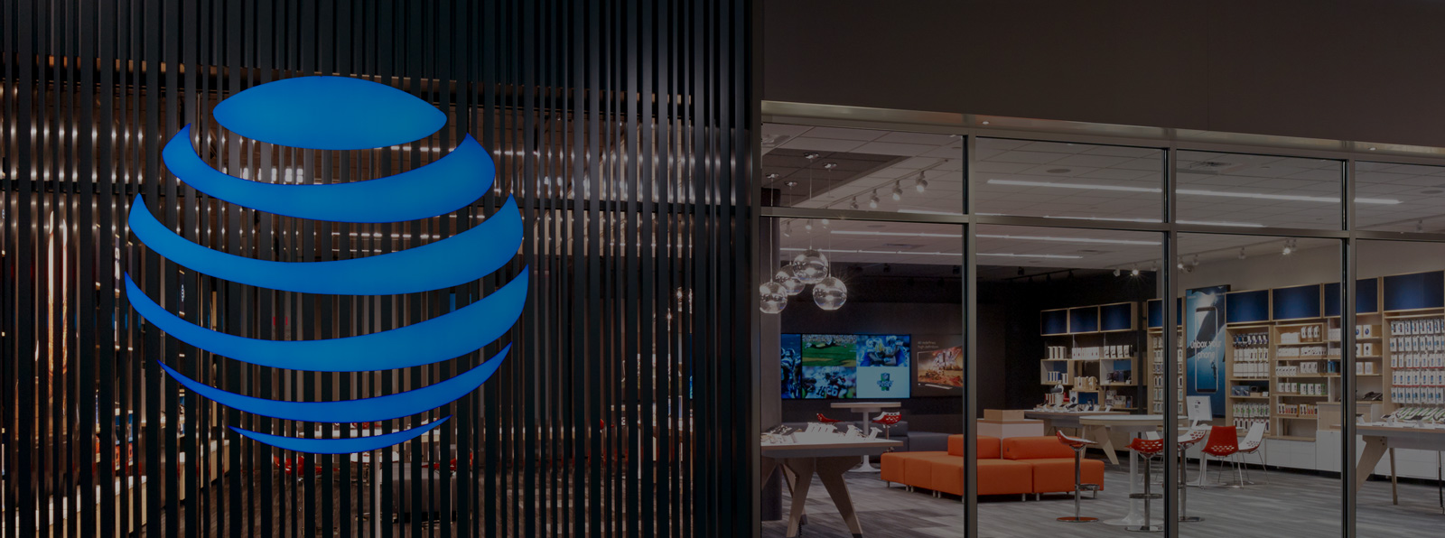 An outside picture of an AT&T retail store with the blue AT&T globe