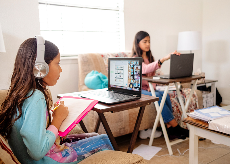 Children participate in e-learning activity at home.