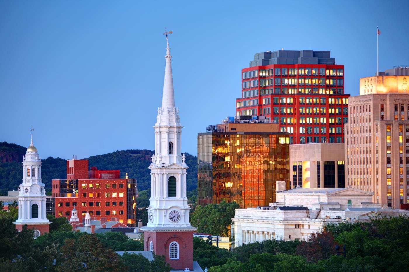 The tops of buildings (including a clocktower) in New Haven, Connecticut