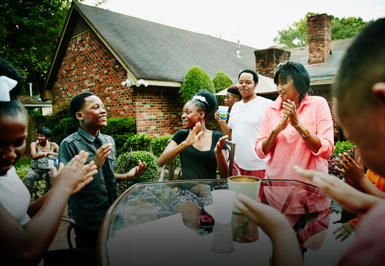 Black community: group of family and friends laughing together. 
