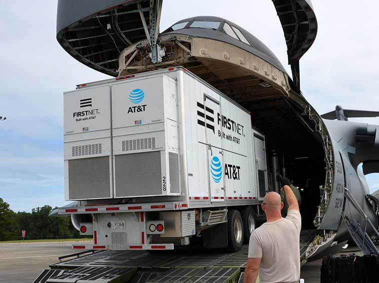Loading a FirstNet truck onto a plane for deployment