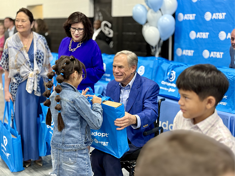 Texas Gov. Greg Abbott distributes AT&T-donated laptops to Center Point ISD students