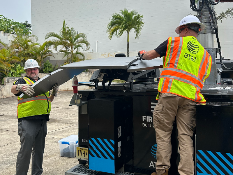 AT&T Network Disaster Recovery (NDR) team members perform readiness check on FirstNet portable cell site in Lihue, Kauai.