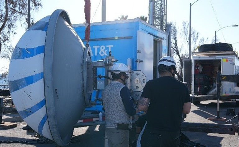 AT&T Network team members set up Super Cell on Wheels (SuperCOW).