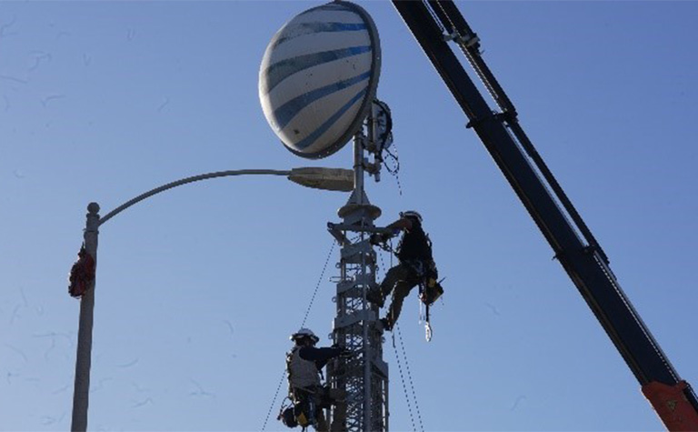 AT&T Network team members set up Super Cell on Wheels (SuperCOW).