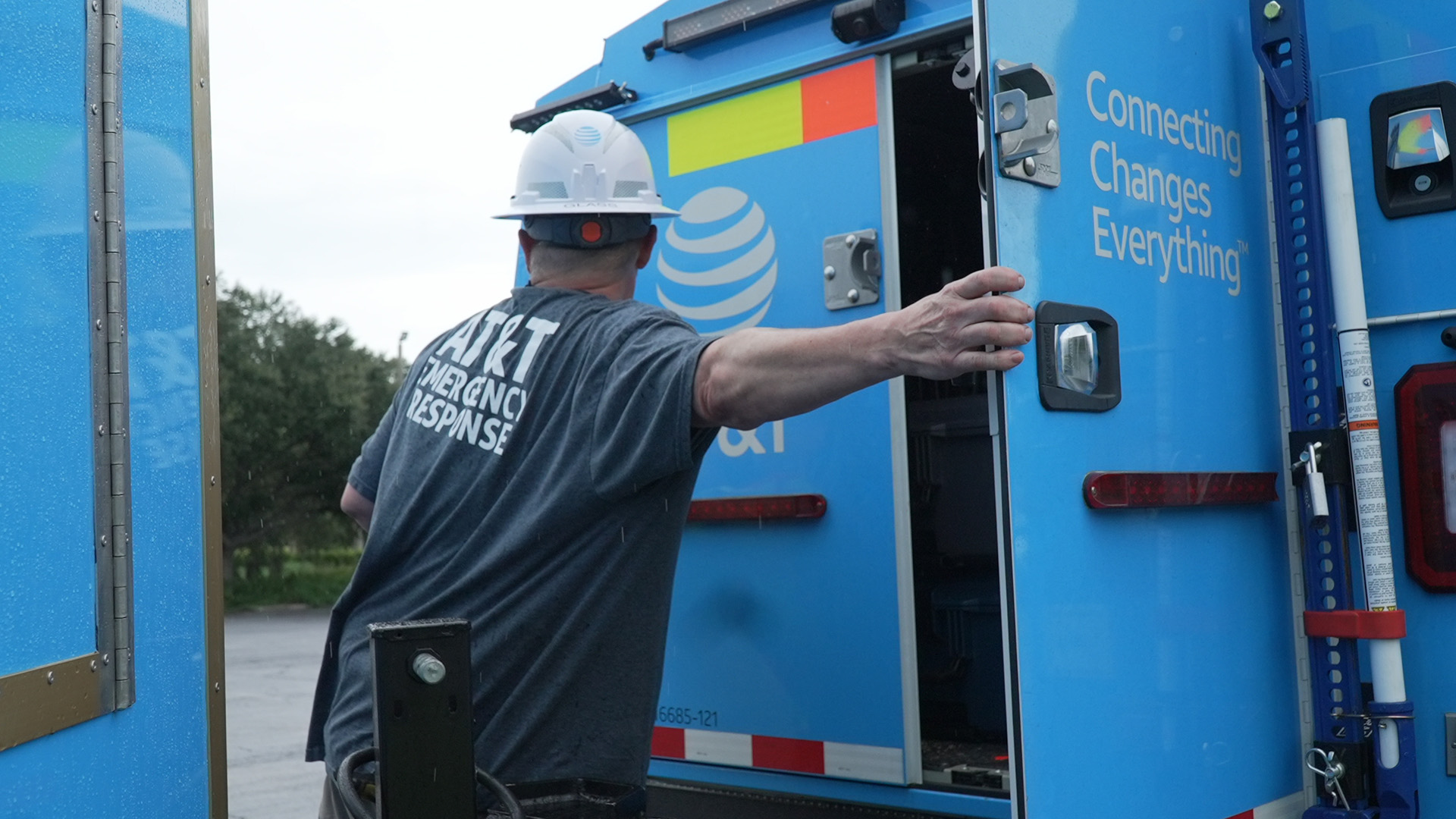 Network Disaster Recovery (NDR) support team member preparing equipment for deployment 