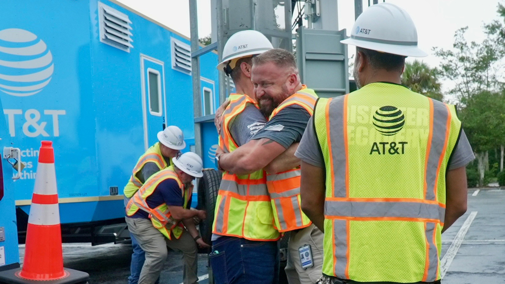 Team members greeting each other before deploying for Hurricane Debby 