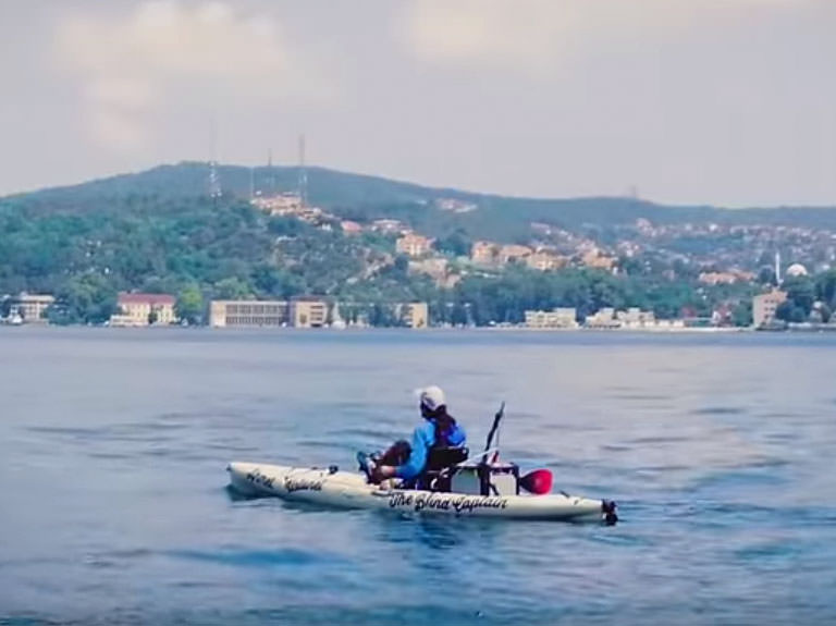 A man rowing in a kayak