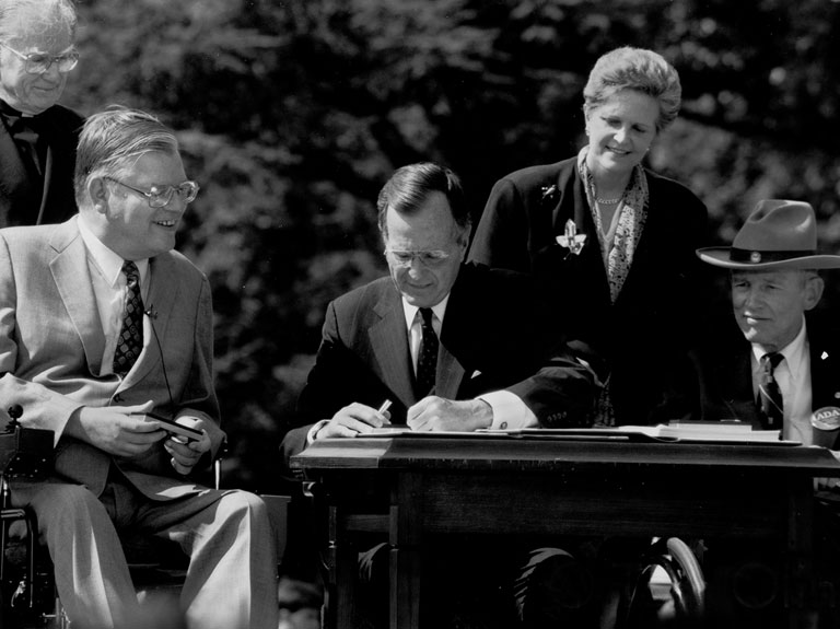 George H. W. Bush signing The Americans with Disabilities Act of 1990