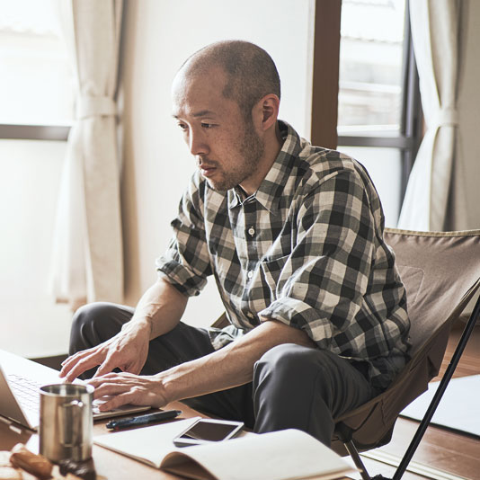 A man sitting at a laptop computer