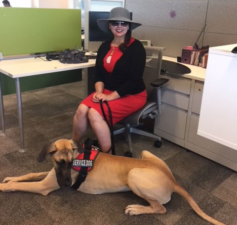 Carolyn_with_her_pet_turned_service_dog_Sopie_at_work.jpg