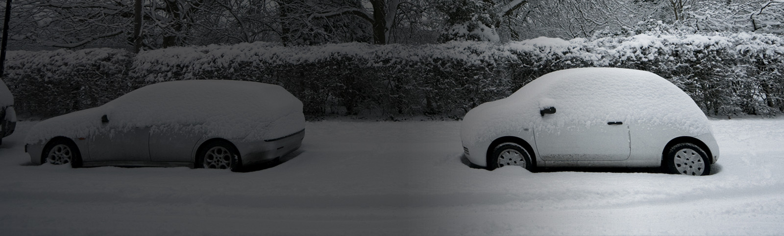 Two cars covered in snow during winter storm Uri in Texas 