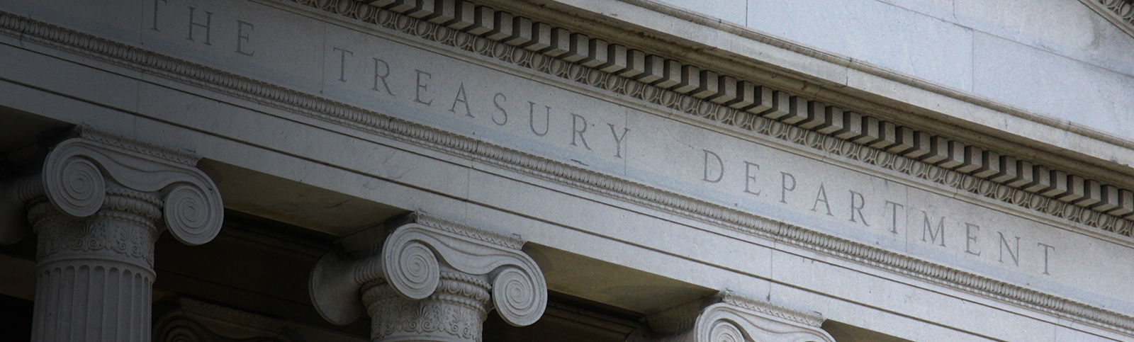 The front of the U.S. Department of Treasury building that reads “The Treasury Department”
