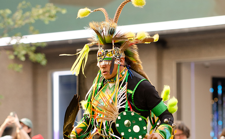 A man performs in celebration of Native American Heritage Month