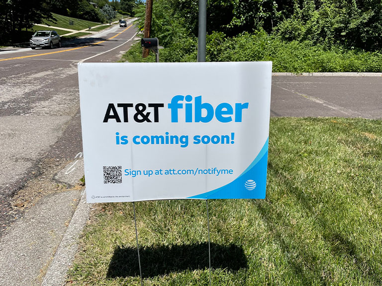 Sign in yard with the text AT&T fiber is coming soon