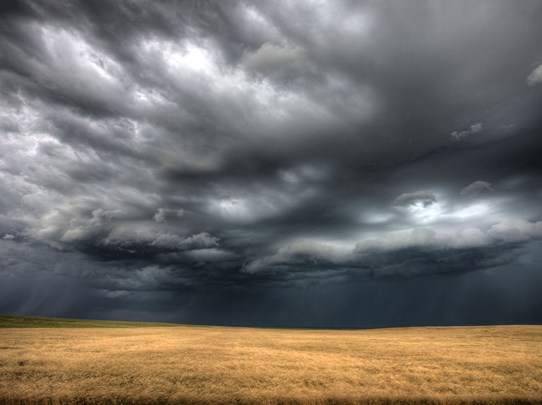 Storm clouds over an open field