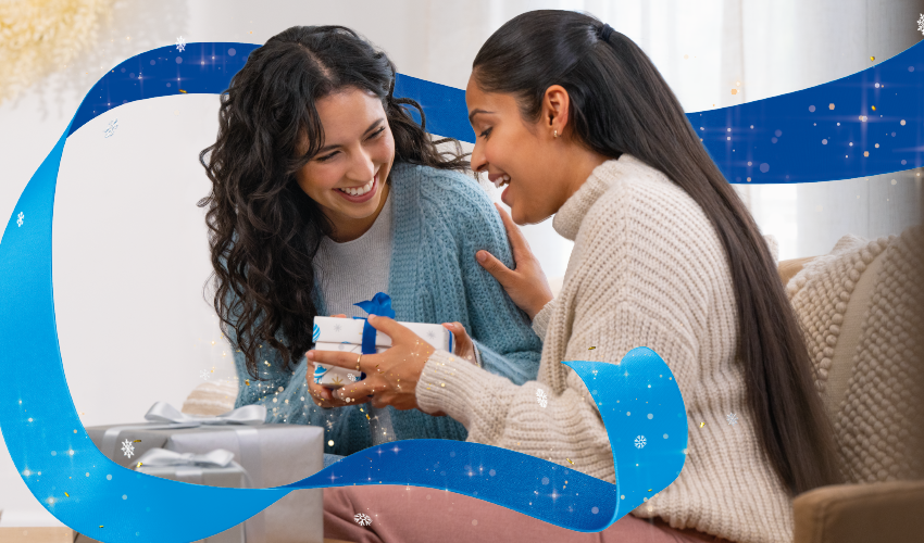 Women happy, smiling with AT&T wrapped gift.